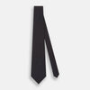 View 2 of product The Turnbull & Asser Turquoise and Forest Green Micro Dot Silk Tie is rolled up, showcasing evenly spaced micro dots on silk, displayed against a plain white background.