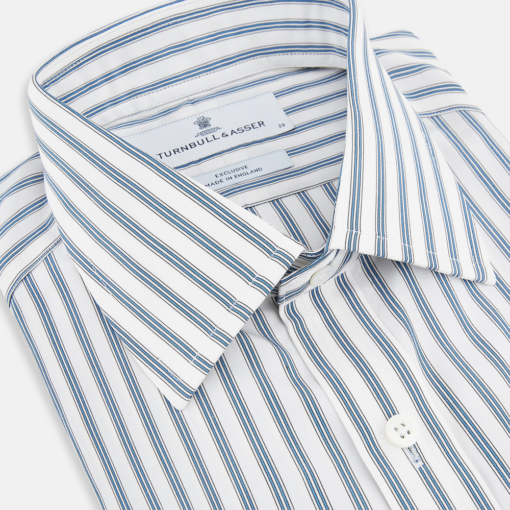 The Turnbull & Asser Blue Multi Wide Track Stripe Mayfair Shirt is a long-sleeve, button-up shirt with a classic collar and vertical blue and white stripes, shown on a white background.