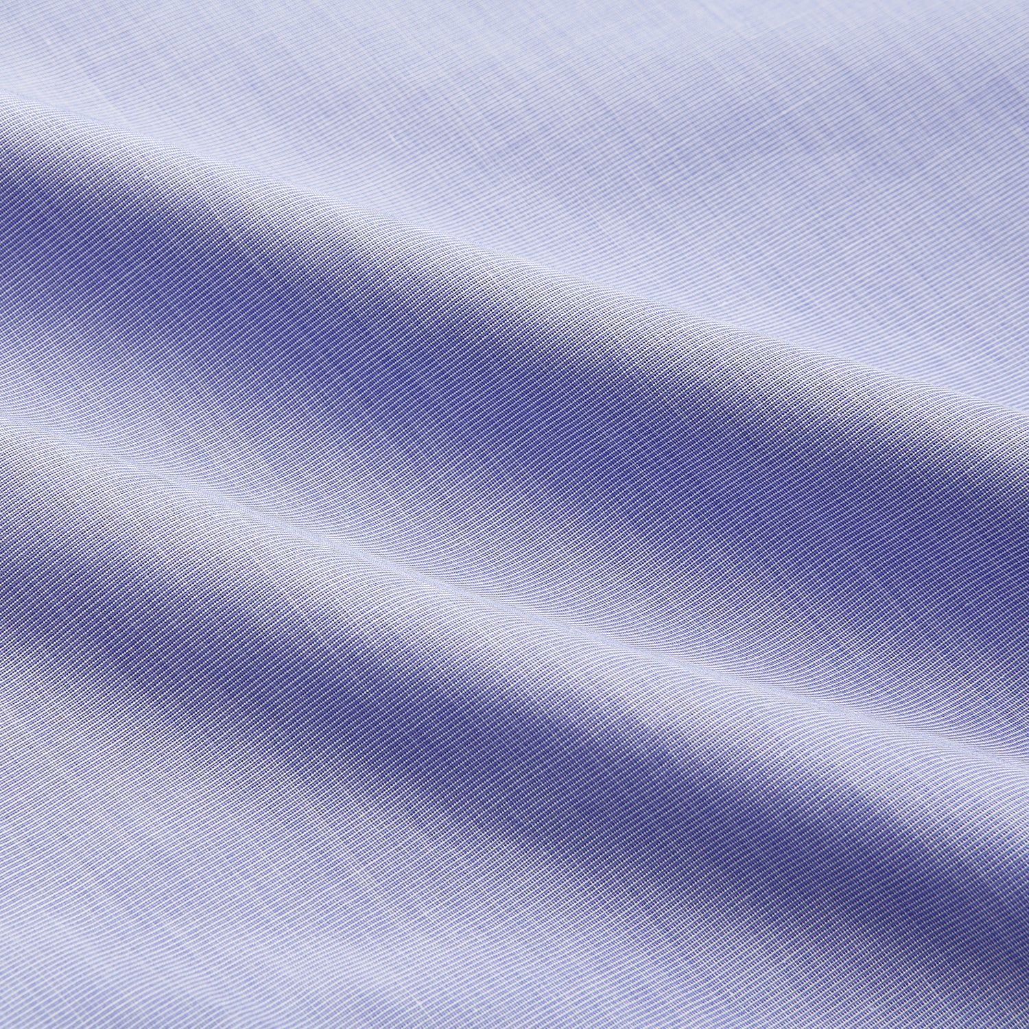 View 5 of product The Turnbull & Asser Tailored Fit Blue End-on-End Cotton Shirt features a Kent collar, double cuffs, and sleek white buttons—an ideal match for a navy suit to complete a sophisticated look. Displayed on a white background.