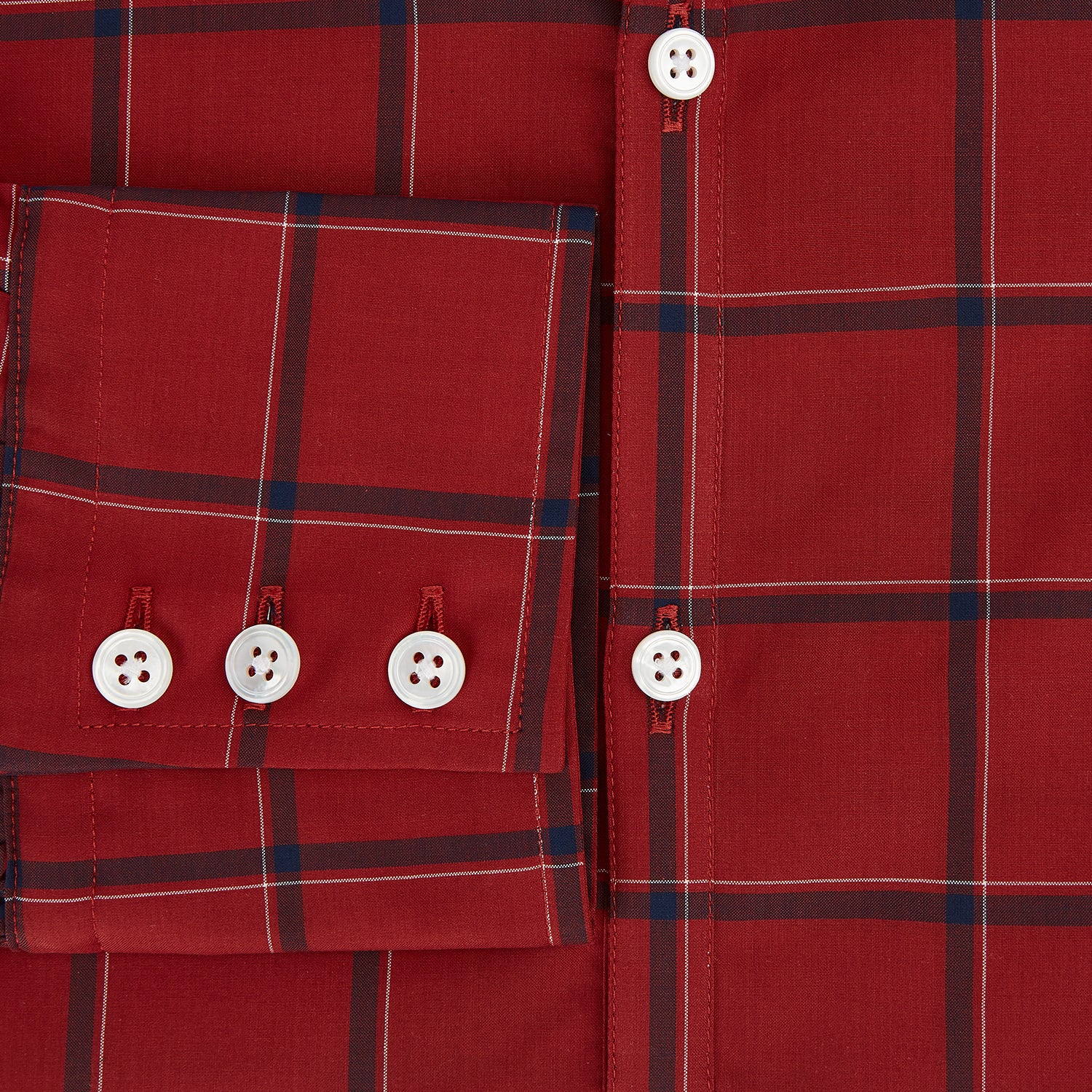 Image 4 of product The Turnbull & Asser Dark Red Grid Check Windsor Shirt is a long-sleeved, button-up shirt with a dark red base and black and white grid pattern, displayed flat on a white background.