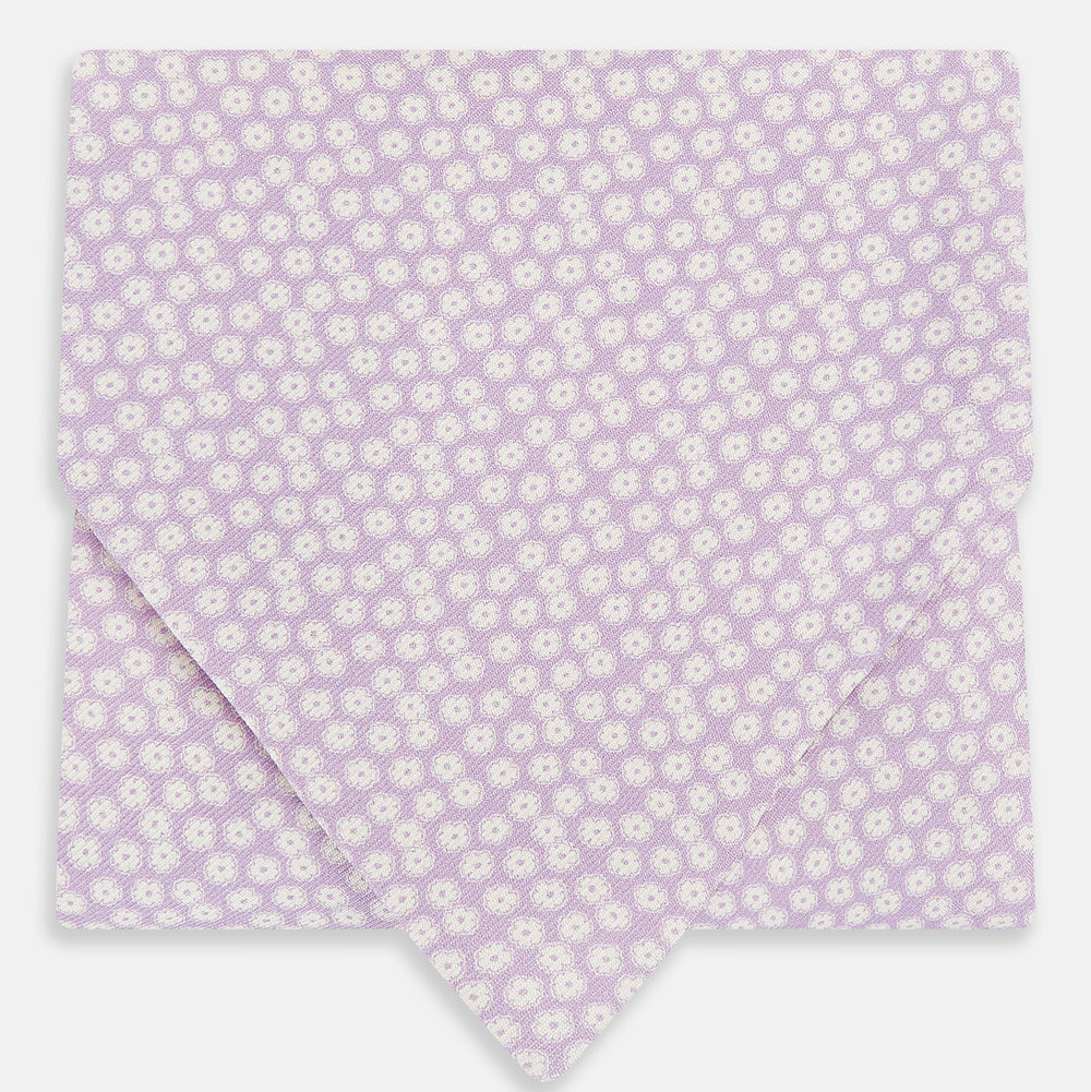 A lilac flower-patterned silk cravat by Turnbull & Asser, elegantly displayed on a white background for a refined touch of British style.
