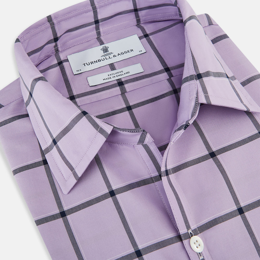 A long-sleeve, button-up Lilac Grid Check Windsor Shirt by Turnbull & Asser, featuring a black windowpane pattern and a refined Windsor collar, displayed on a plain white background.