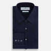 View 5 of product The Navy Linen Westminster Shirt by Turnbull & Asser features a classic collar and buttoned cuffs, exemplifying British craftsmanship. Shown here in long sleeves, the shirt is displayed flat against a white background.