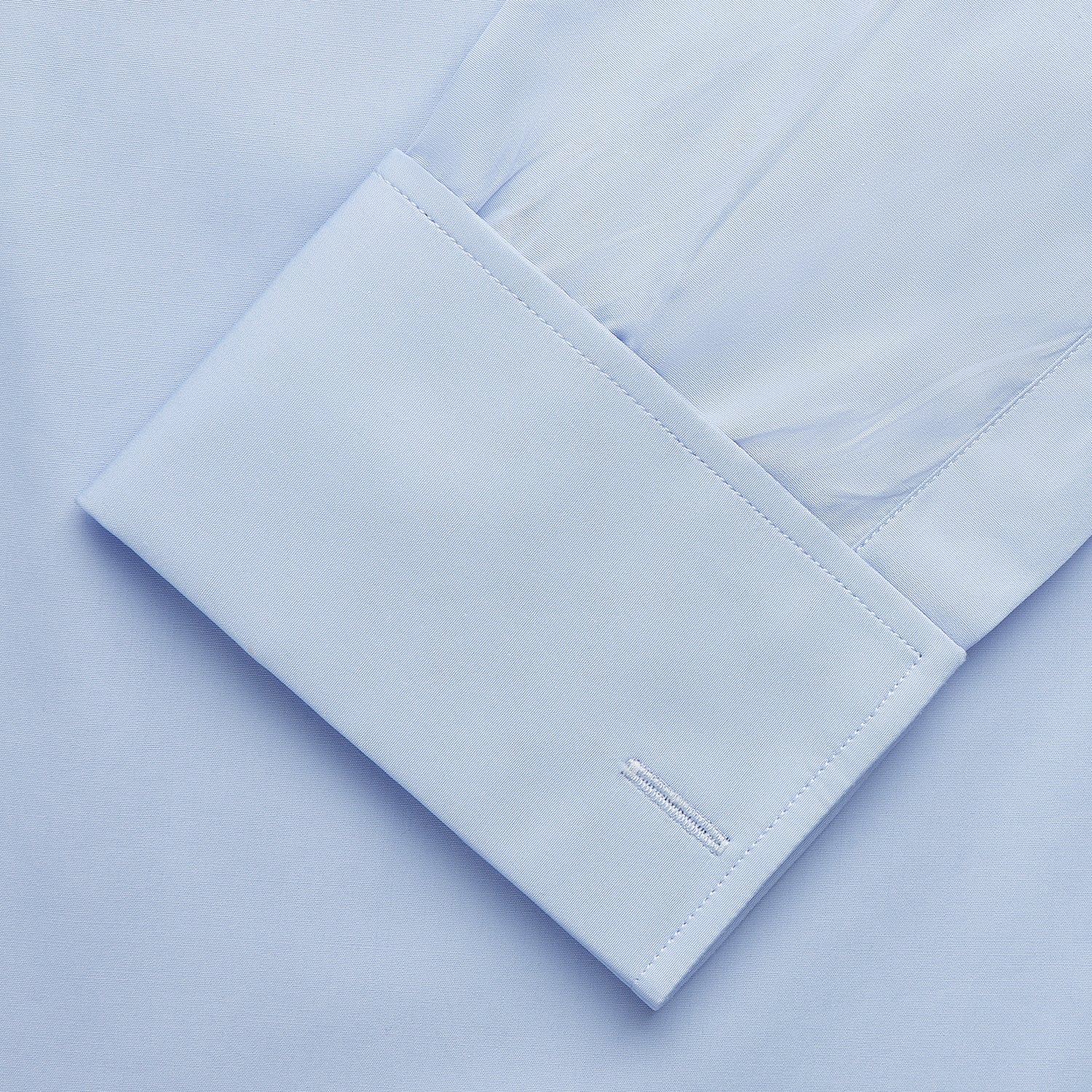 View 4 of product The Turnbull & Asser Tailored Fit Pale Blue Cotton Shirt features a Kent collar and double cuffs—ideal for pairing with a navy suit.