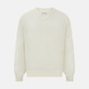 View 1 of product The Turnbull & Asser Cream Fine Merino V-Neck Jumper features long sleeves and classic styling, displayed against a white background.