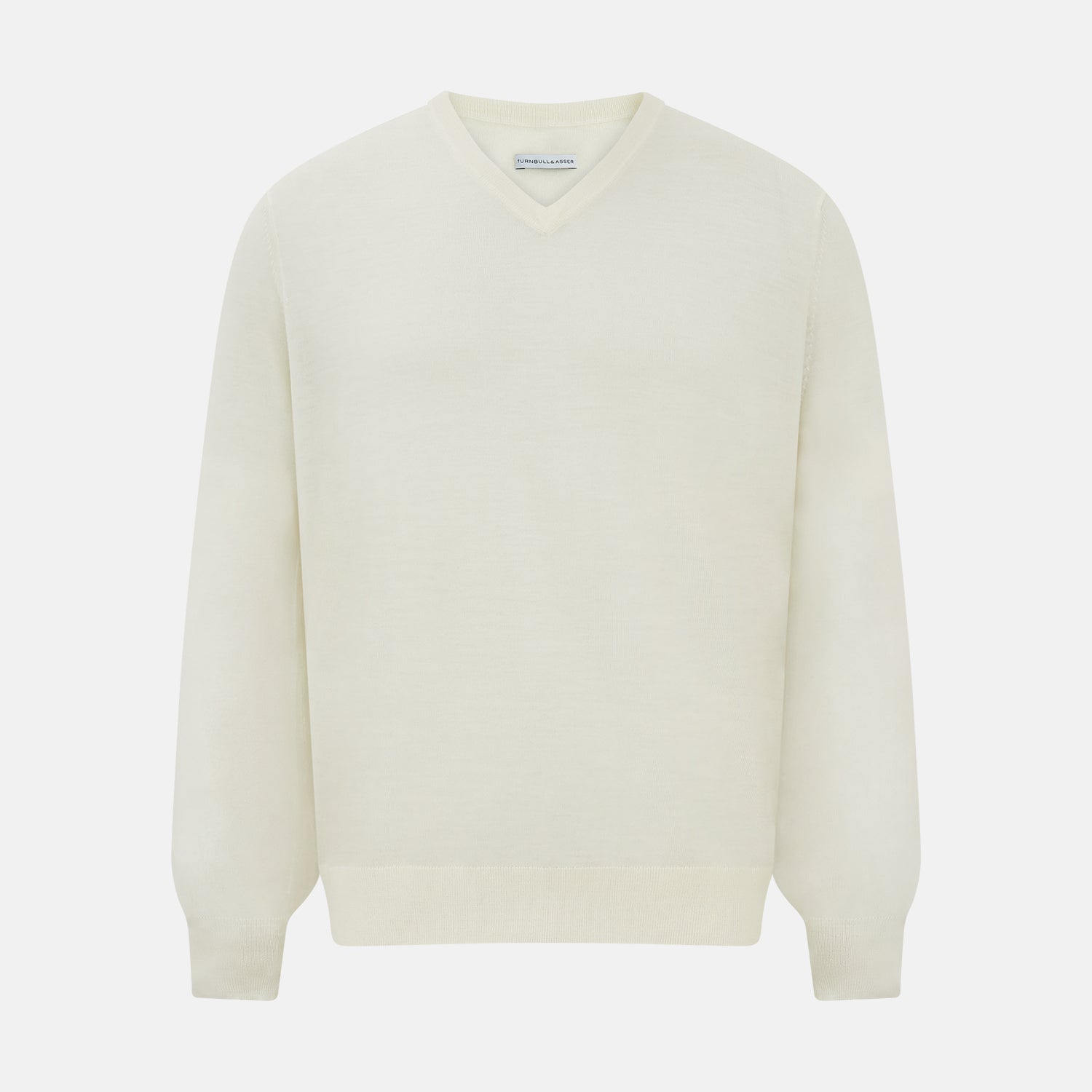 View 1 of product The Turnbull & Asser Cream Fine Merino V-Neck Jumper features long sleeves and classic styling, displayed against a white background.