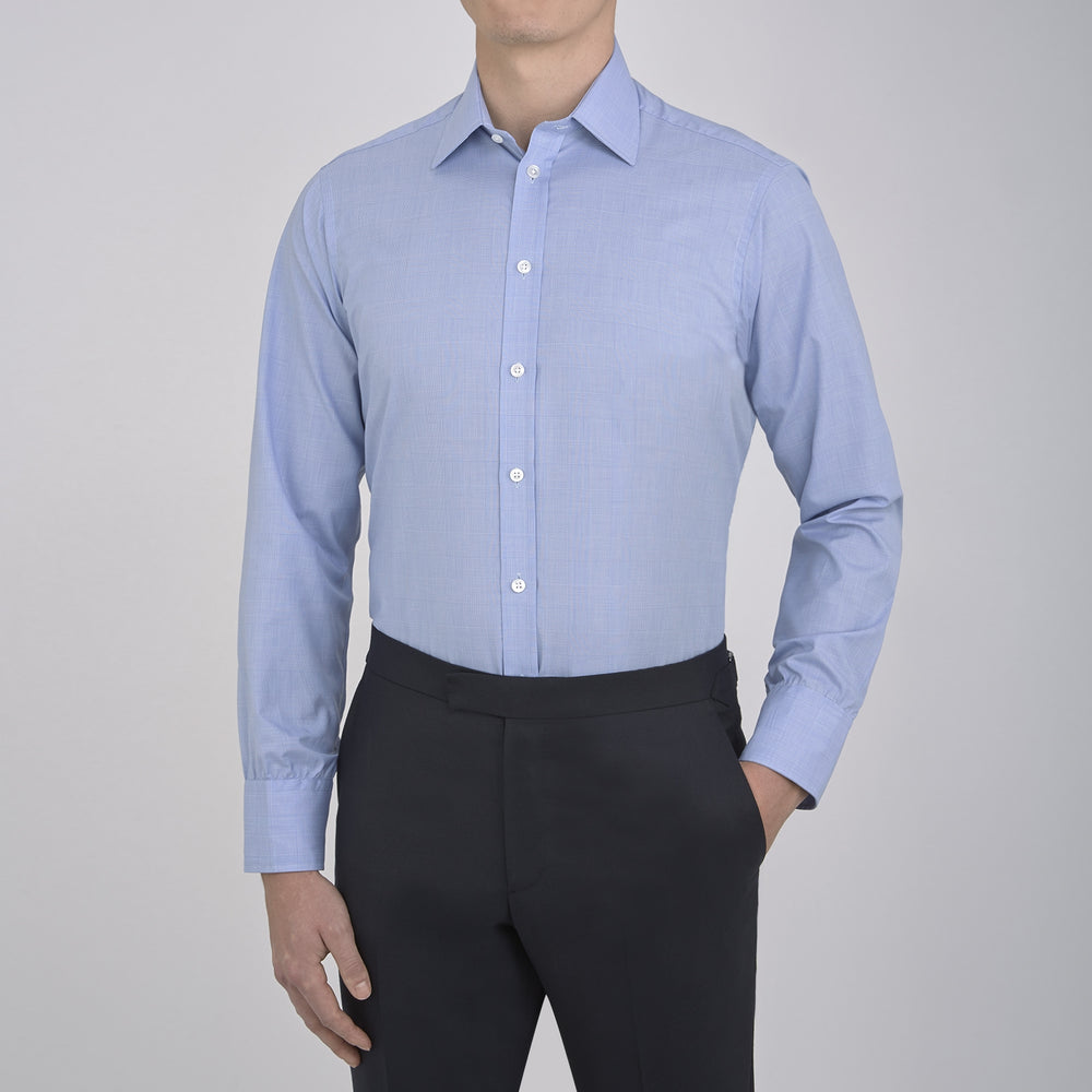 A Blue Prince of Wales Check Shirt by Turnbull & Asser, featuring a T&A collar and 3-button cuffs, is neatly folded and displayed on a plain white background.