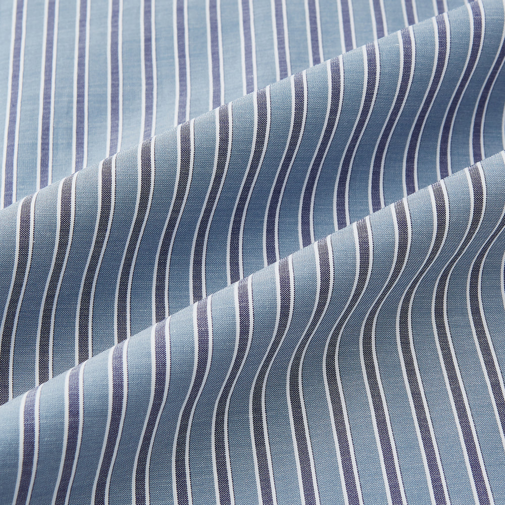 The Steel Grey Ticking Stripe Mayfair Shirt by Turnbull & Asser is a long-sleeved, button-up shirt with a collar, crafted from fine Italian cotton and featuring slim steel grey and white stripes with white buttons for a classic touch.