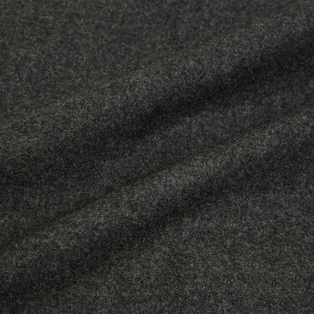 The Graphite Melange Collared Single-breasted Waistcoat by Turnbull & Asser features a dark gray hue, front buttons, collar, two zippered side pockets, and a chest pocket—perfect for winter. Shown on a plain white background.