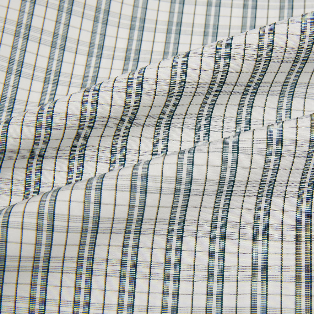 The Turnbull & Asser Forest Green Multi Check Mayfair Shirt is a long-sleeve button-up crafted from premium Italian cotton, featuring a blue and forest green check on white, with a pointed collar and buttoned cuffs.