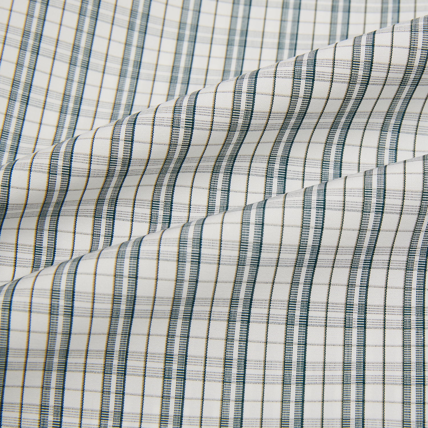 View 6 of product The Turnbull & Asser Forest Green Multi Check Mayfair Shirt is a long-sleeve button-up crafted from premium Italian cotton, featuring a blue and forest green check on white, with a pointed collar and buttoned cuffs.