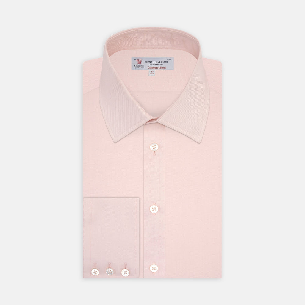 The Turnbull & Asser Pink Cashmere Blend Shirt features a T&A collar and 3-button cuffs, neatly folded with white buttons, displayed on a plain white background.