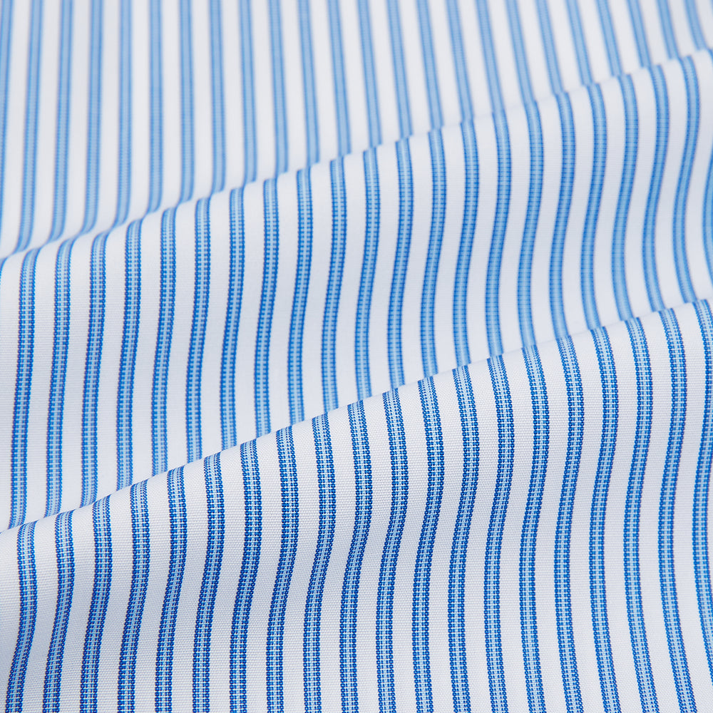 The Sky Blue Halo Stripe Mayfair Shirt by Turnbull & Asser, a long-sleeved button-up with thin blue and white vertical stripes, classic collar and cuffs, is shown laid flat on a white background.