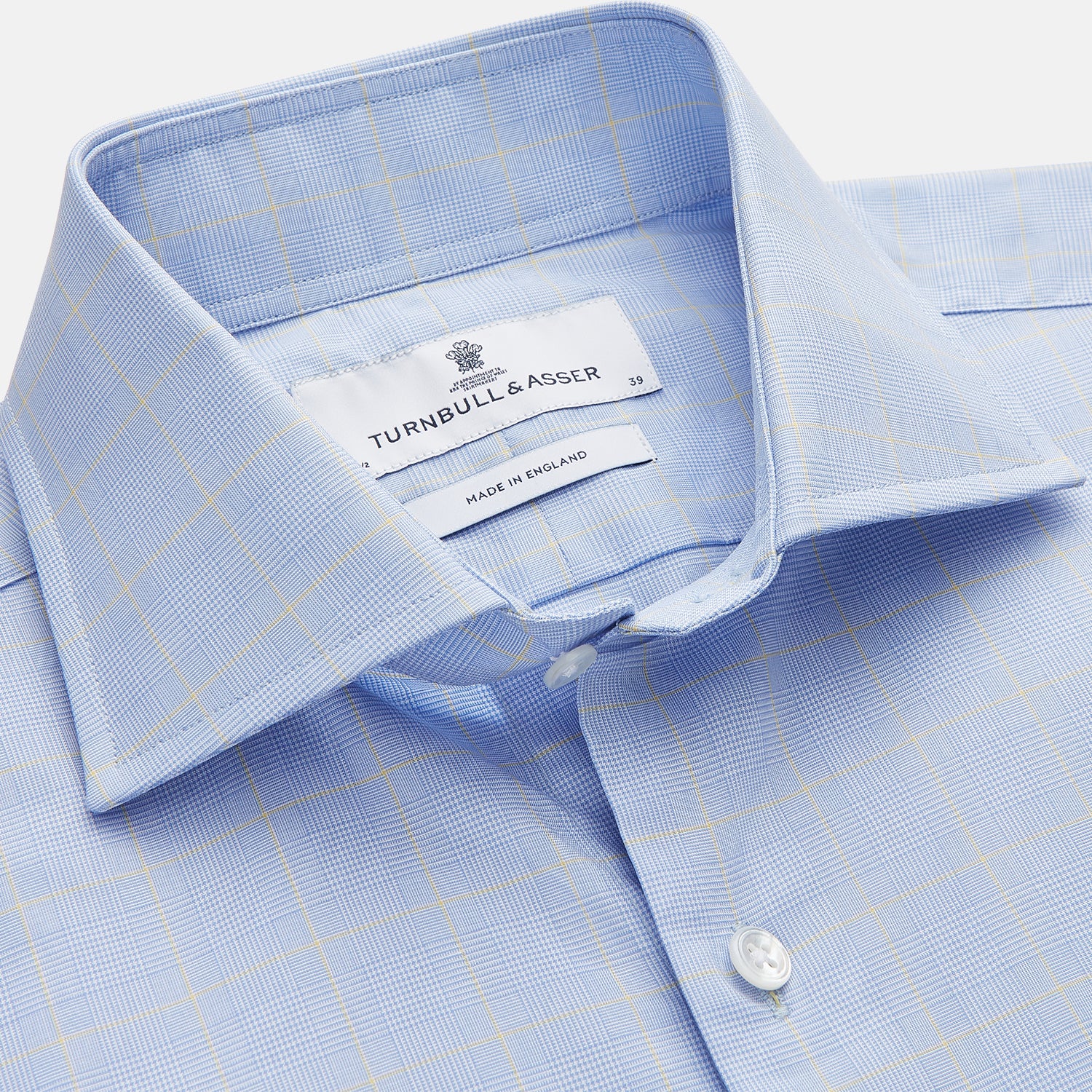 View 2 of product The Yellow and Blue Prince of Wales Check Belgravia Shirt by Turnbull & Asser features a classic collar, white buttons, long sleeves, and a checked pattern, displayed laid flat on a white background.