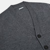 View 2 of product The Turnbull & Asser Grey Melange Cashmere Cardigan features a V-neck, ribbed cuffs and hem, front buttons, and two pockets—an elegant piece from our timeless knitwear collection. Shown here against a plain white background.