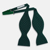 View 2 of product The Turnbull & Asser Dark Green and Navy Micro Dot Silk Bow Tie, featuring a refined dotted pattern, is showcased on a plain white background—an elegant accessory perfect for any occasion.