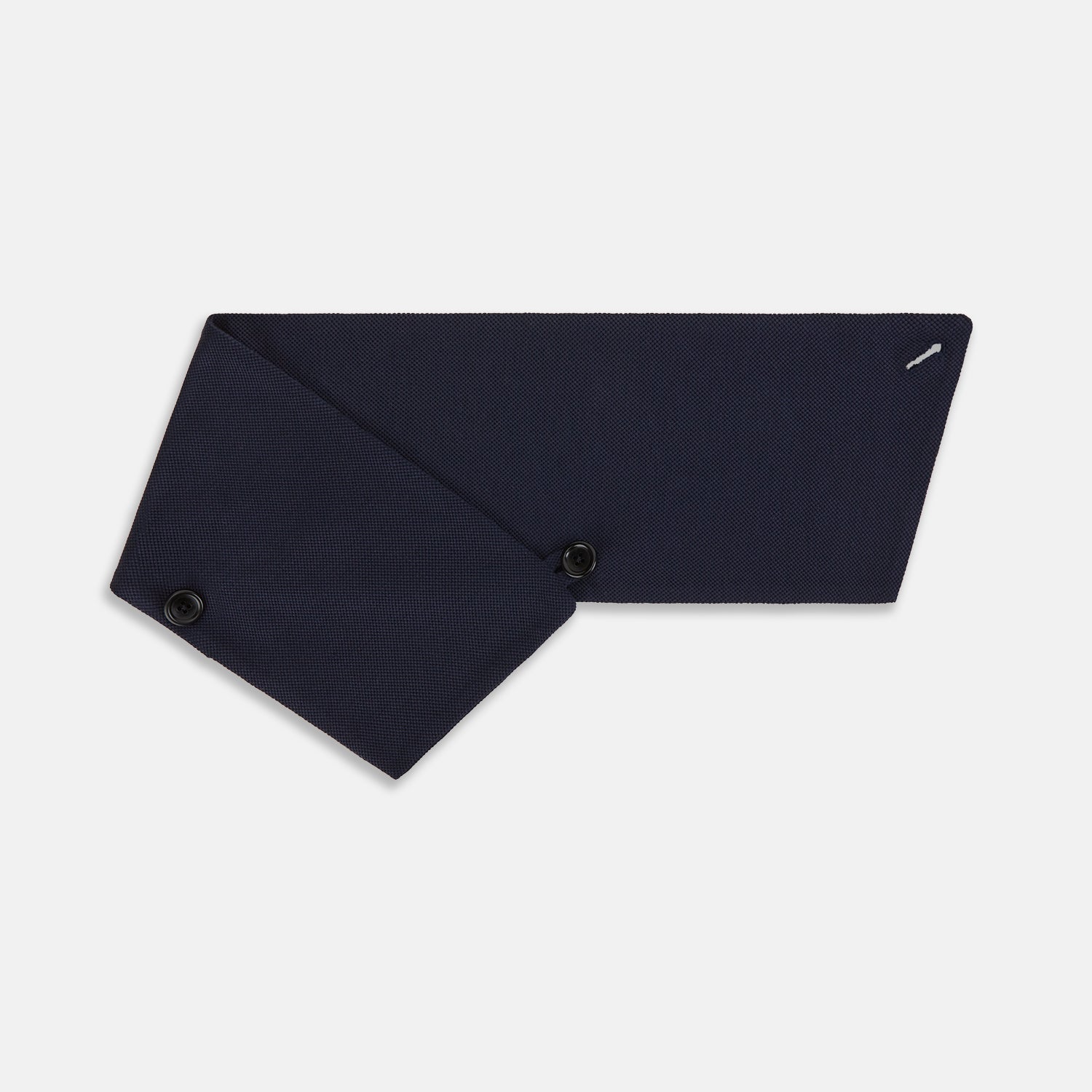 Image 3 of product The Turnbull & Asser Navy Silk and Cotton Neck Warmer features a dark navy blue textured fabric and a single black button, shown against a plain light gray background.