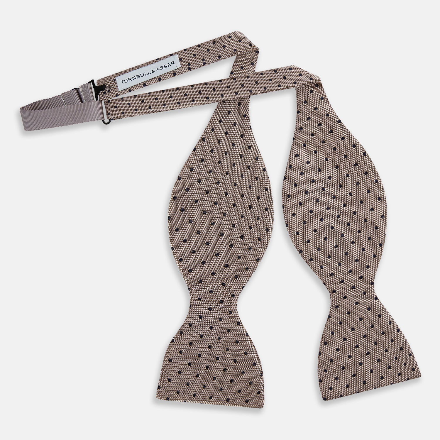 View 2 of product The Turnbull & Asser Navy and Taupe Micro Dot Silk Bow Tie features a grid pattern with small dots, shown against a plain white background.