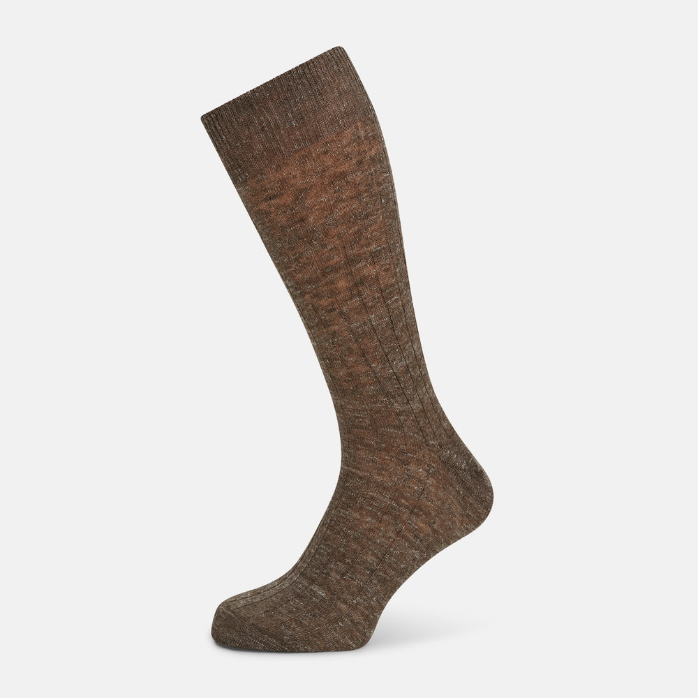 A single Dark Chocolate Linen Mid-Length Sock by Turnbull & Asser, ribbed and breathable, stands upright with its foot slightly raised against a plain white background.