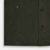 View 6 of product The Turnbull & Asser Olive Corduroy Hampstead Overshirt for men features a collar, long sleeves, left chest pocket, and two zippered side pockets, shown laid flat on a white background.