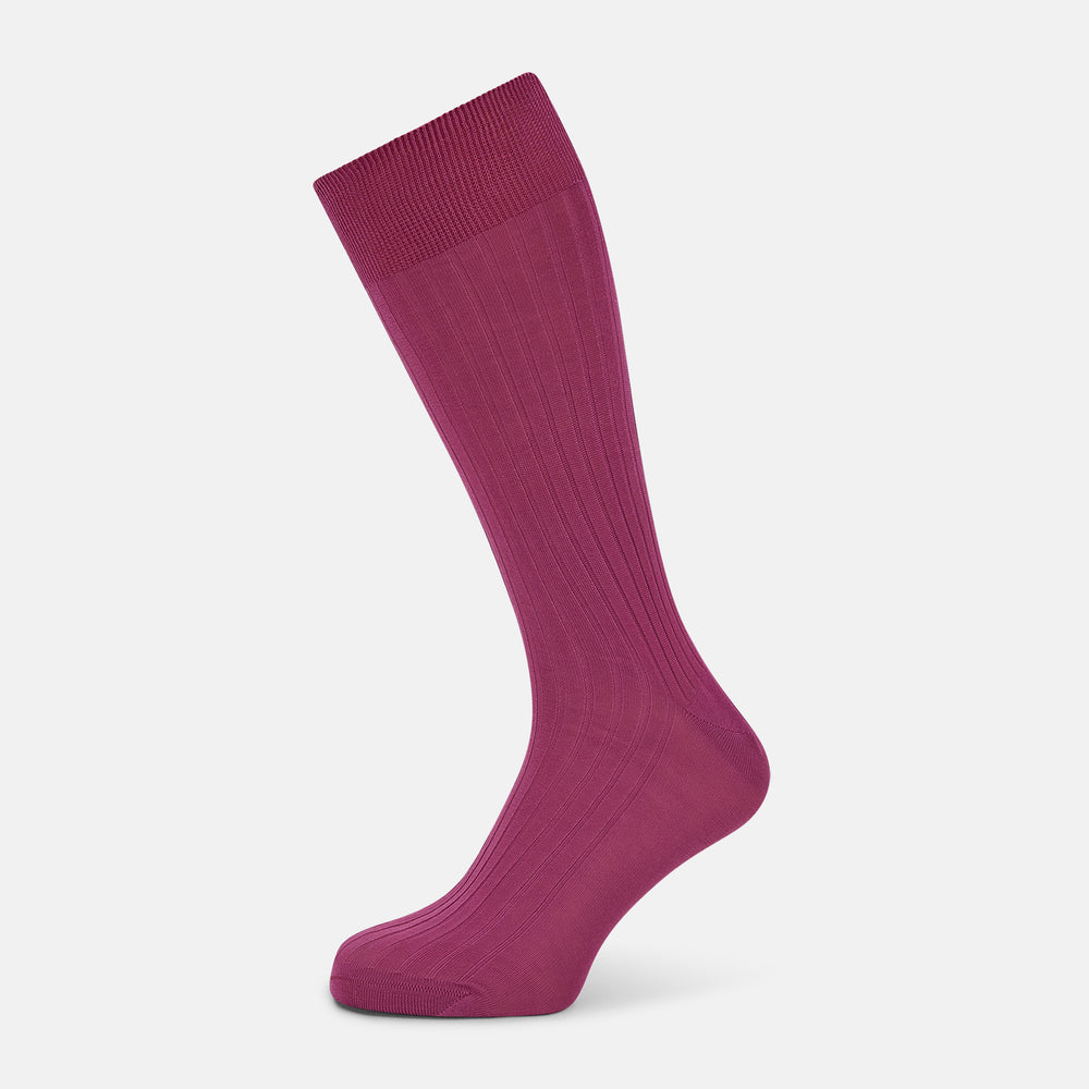 A single Turnbull & Asser Pink Mid-Length Sock is shown upright on a plain white background. The luxury sock has a ribbed texture and a subtly darker ribbed cuff at the top, creating an elegant finish.