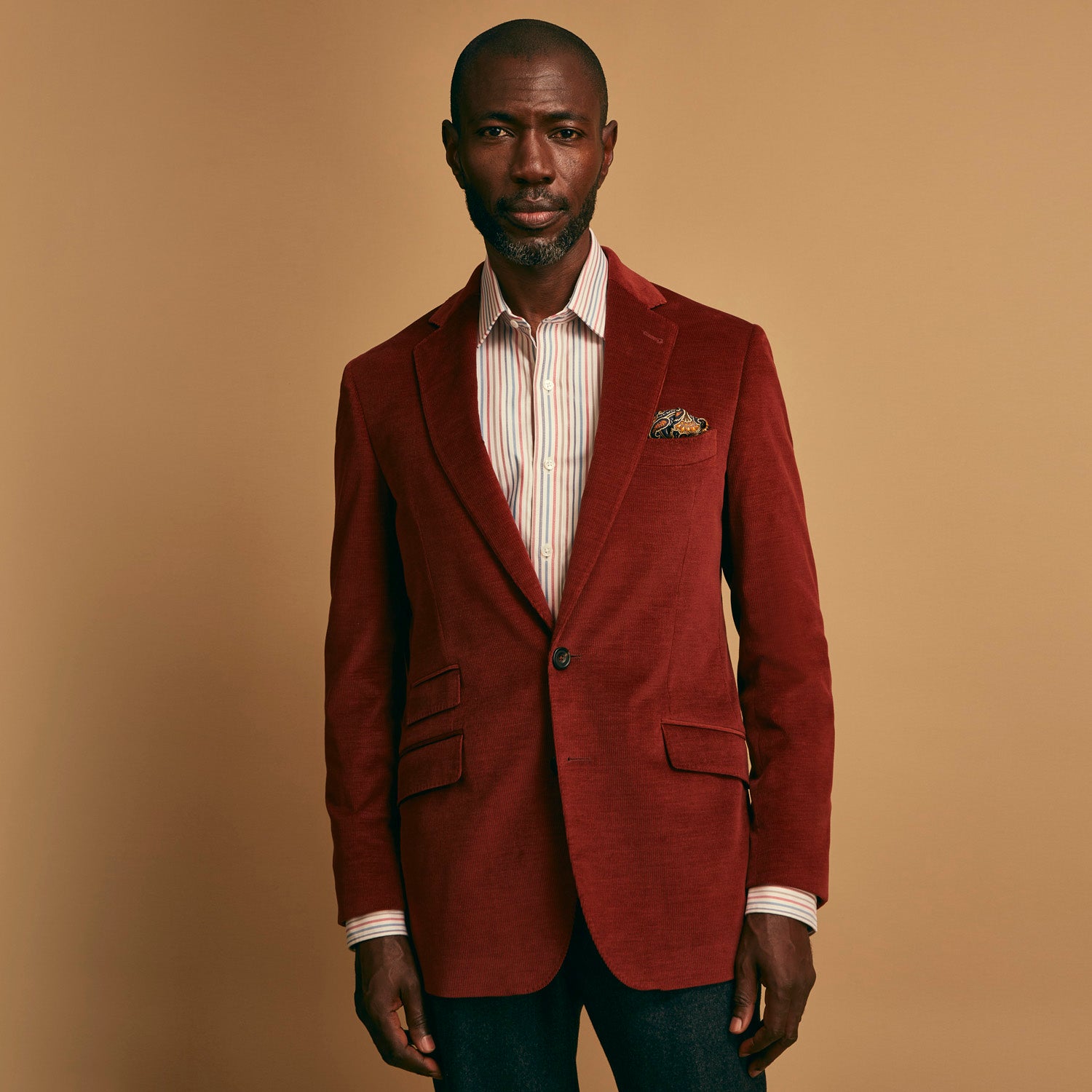 View 2 of product The Rust Cord Barrington Blazer by Turnbull & Asser is tailored in Italy with notch lapels, two front buttons, three pockets, and four-button cuffs, shown flat on a white background.