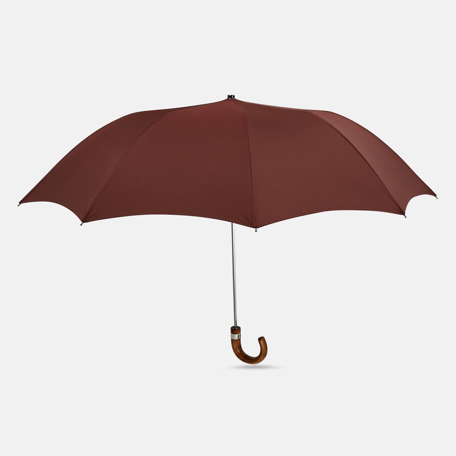 View 1 of product A fully opened Turnbull & Asser Burgundy Telescopic Umbrella with a brown maple crook handle, displayed against a plain white background—a refined men's accessory.