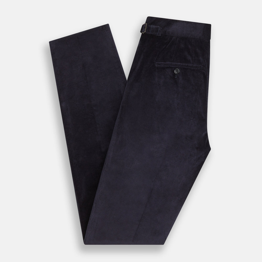 The Turnbull & Asser Navy Corduroy Henry Trousers are tailored fit with a straight-leg cut, made from a wool-cotton blend, and feature front button and zip closure, shown against a plain white background.