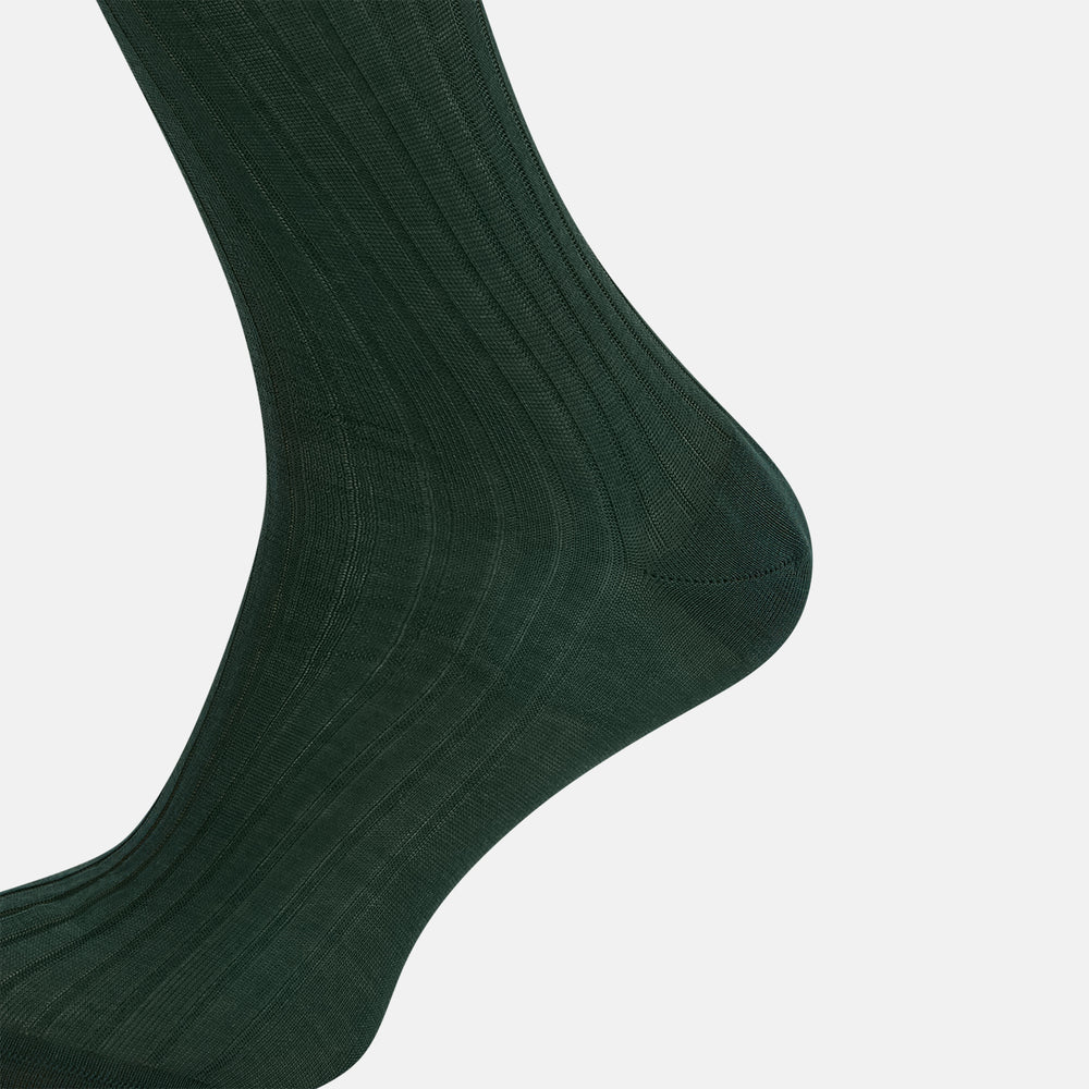 The Turnbull & Asser Olive Long Socks, featuring a ribbed texture, are shown over the calf on a plain white background—a refined addition to any men’s dress sock collection.