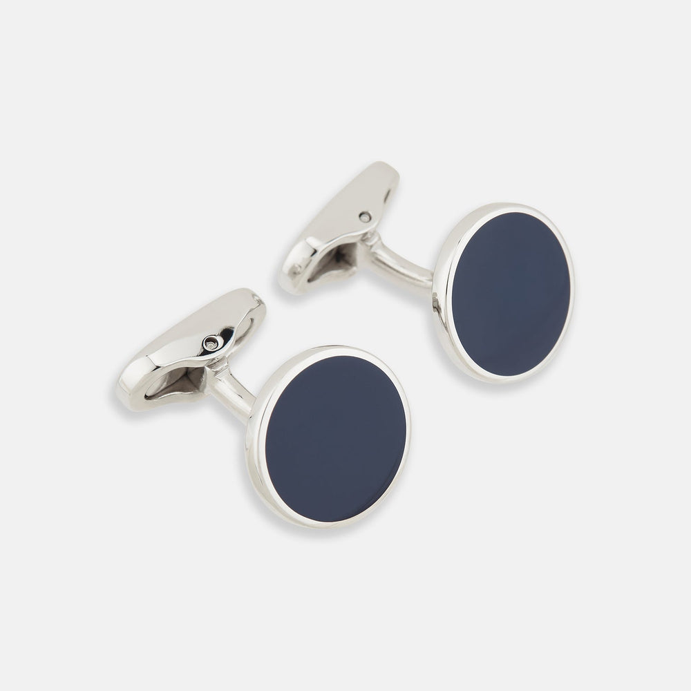 Turnbull & Asser’s Navy Circle Cufflinks feature round sterling silver with deep navy faces, shown on a white background—a classic men’s accessory.