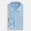 View 5 of product The Turnbull & Asser Dr. No Blue Cotton Shirt with cocktail cuffs, inspired by James Bond, features a classic collar and white buttons, displayed on a plain white background.