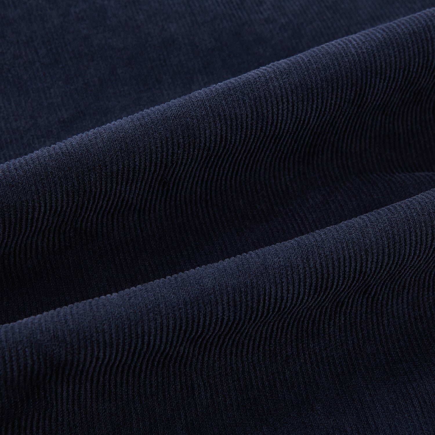 View 7 of product The Turnbull & Asser Light Navy Corduroy Charles Trousers feature a straight-leg fit, stretch cotton, belt loops, front pockets, and a button-zip closure—highlighting British tailoring against a white background.