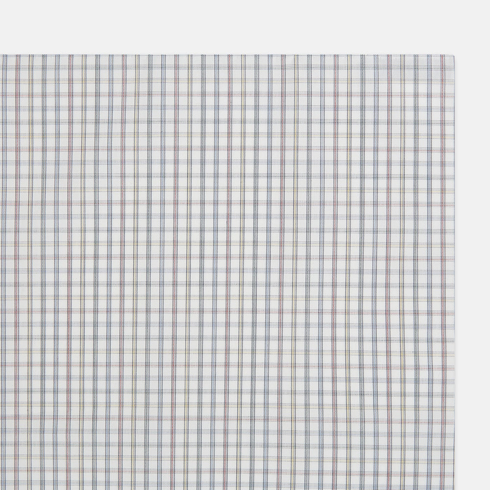 The Sky Blue Multi Graph Check Hand-Rolled Handkerchief by Turnbull & Asser features thin blue, red, and beige lines forming small squares on white fabric. Crafted in England.