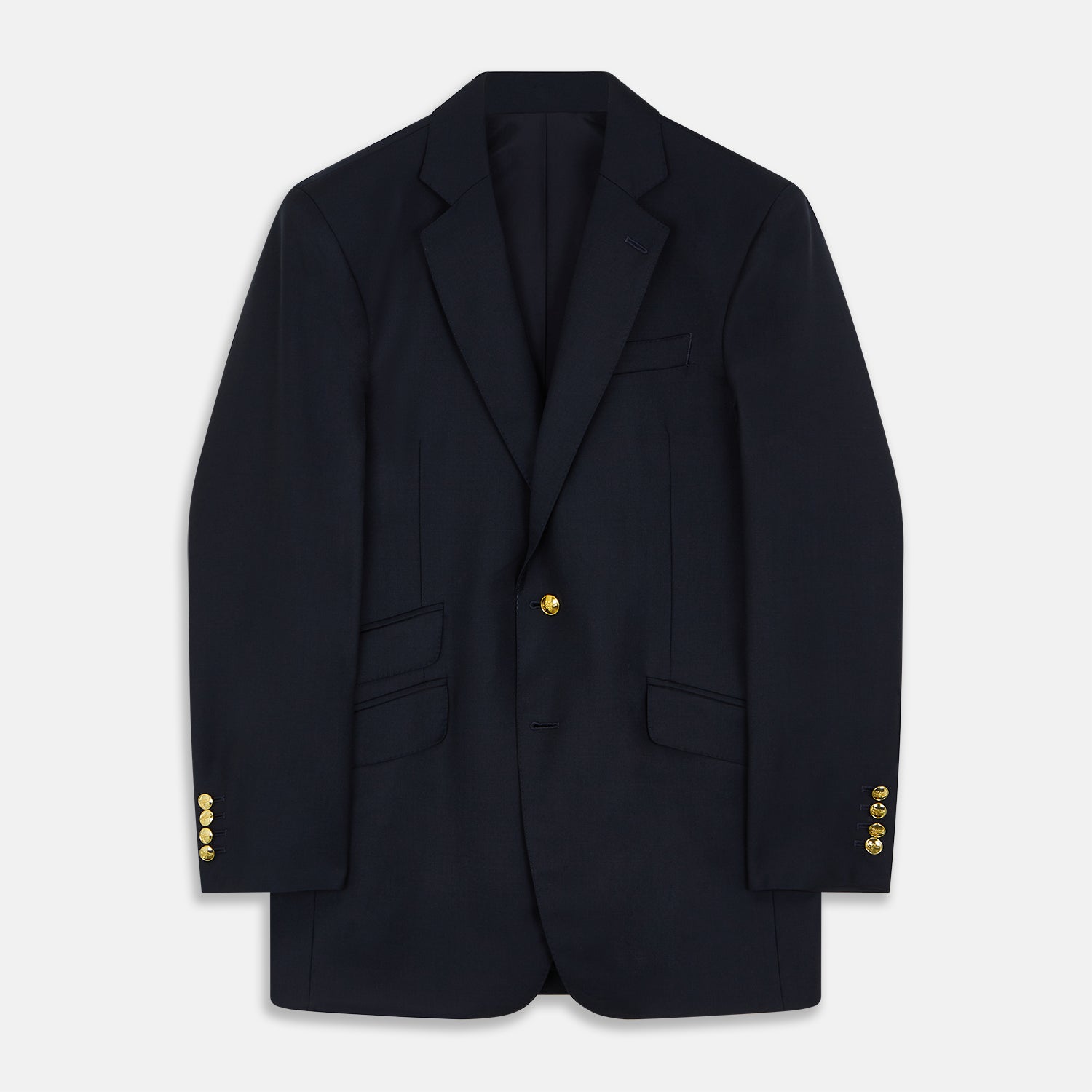 View 1 of product The Turnbull & Asser Navy Plain Wool Single Breasted Blazer, with brass front and cuff buttons and an asymmetric pocket design, is shown laid flat on a white background.