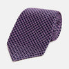 View 1 of product A rolled-up Turnbull & Asser Purple and Navy Diamond Silk Tie displays its elegant grid pattern of light pink and white lines on a white background.