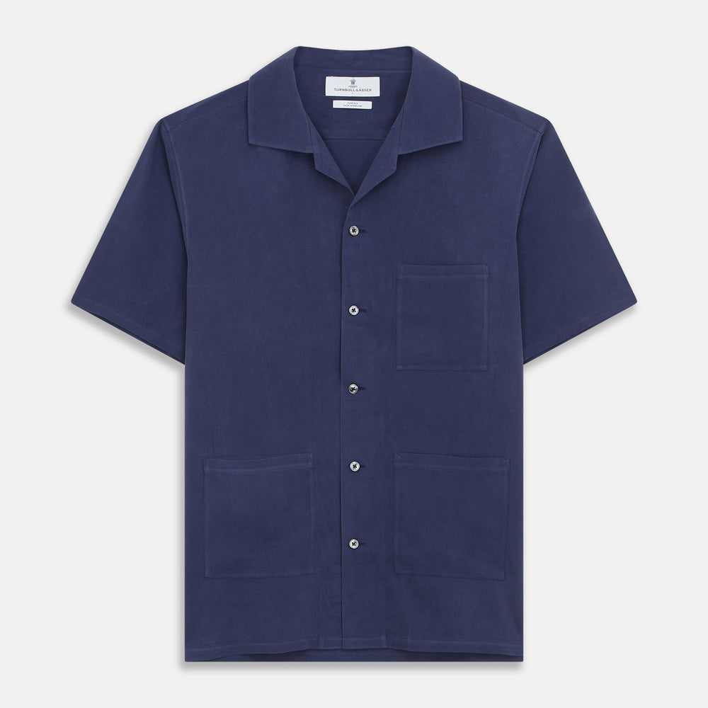 The Navy Silk Holiday Fit Phillips Shirt by Turnbull & Asser features short sleeves, a revere collar, and three front patch pockets, shown laid flat on a white background.