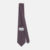 View 4 of product The Turnbull & Asser Red and Navy Oval-Patterned Silk Tie features a refined oval motif on navy silk, ideal for formal wear, and is showcased on a plain white background.