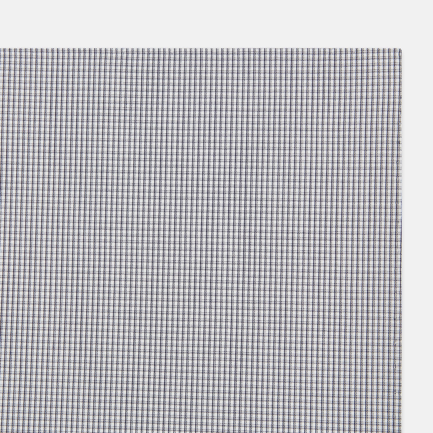 Image 2 of product The Turnbull & Asser Navy Blue Shadow Grid Check Hand-Rolled Handkerchief showcases a small, evenly spaced blue and white check pattern and hand-rolled edges, neatly displayed against a white background.