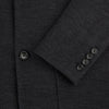 View 4 of product The Turnbull & Asser Charcoal Knitted Oxford Blazer features a notched lapel, two-button closure, and three front pockets, blending modern elegance with British heritage against a plain white background.