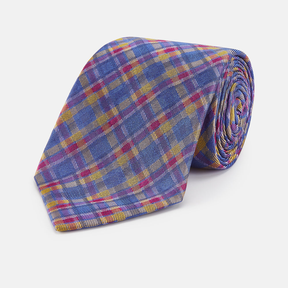 The Turnbull & Asser Blue Multi Tartan Silk Tie features a vibrant blue, yellow, and pink plaid pattern and is shown rolled up on a white background.