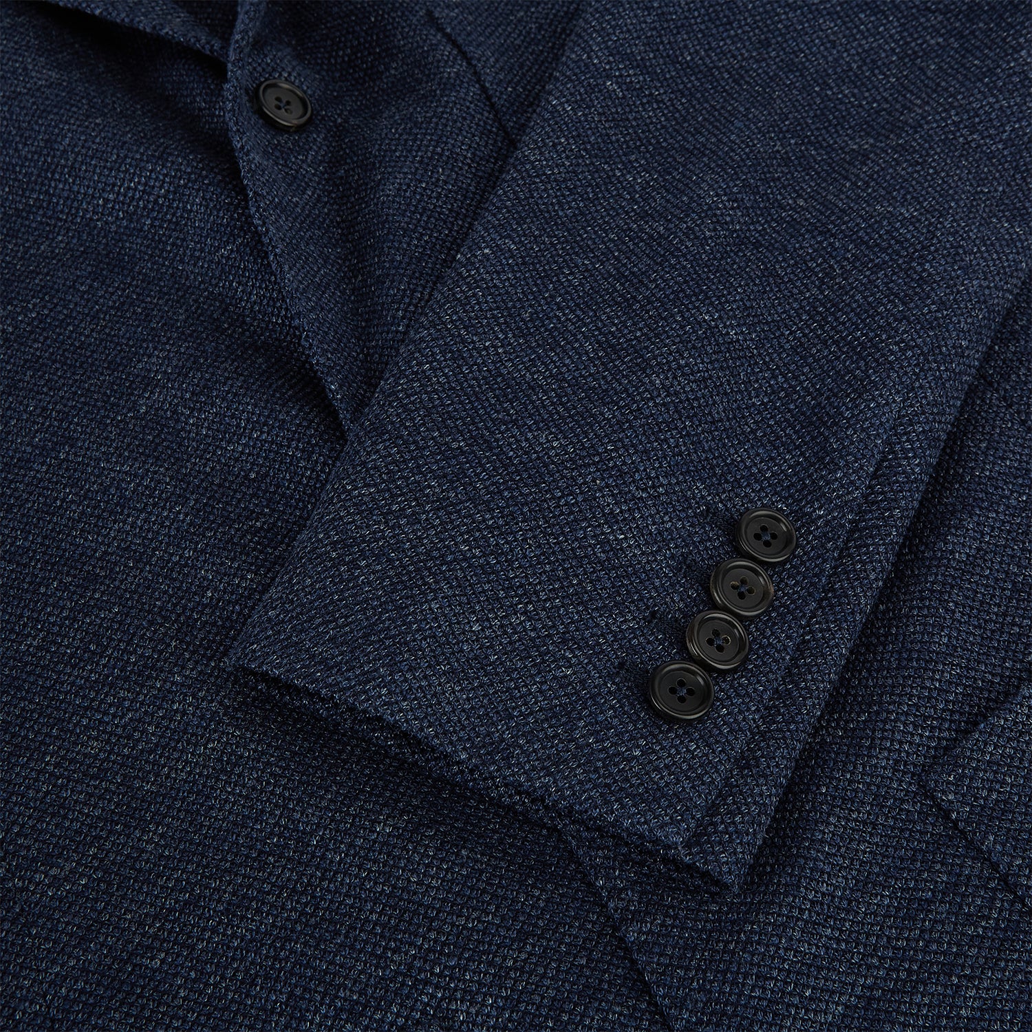 View 4 of product The Turnbull & Asser Navy Linen Blend Cambridge blazer features British tailoring with a notched lapel, two buttons, and three front pockets, shown on a plain white background.