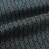 View 4 of product The Forest Green and Red Weave Patterned Silk Cravat by Turnbull & Asser features an elegant geometric design in rich hues, folded to a pointed end for a classic, British-inspired look.