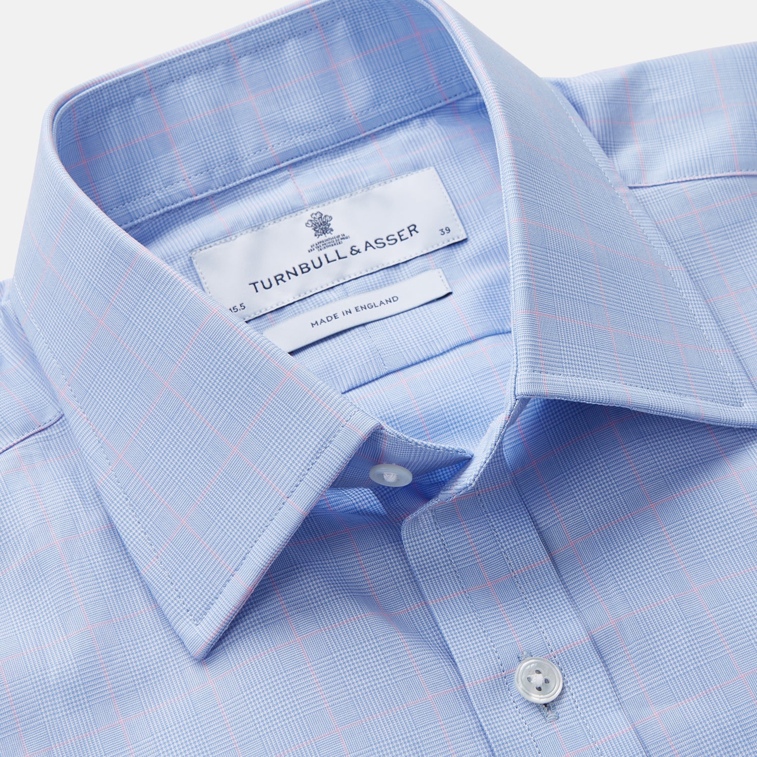 View 2 of product A Turnbull & Asser Blue and Pink Prince of Wales Check Mayfair Shirt with long sleeves, classic collar, buttoned front and cuffs, is neatly laid flat on a white background.