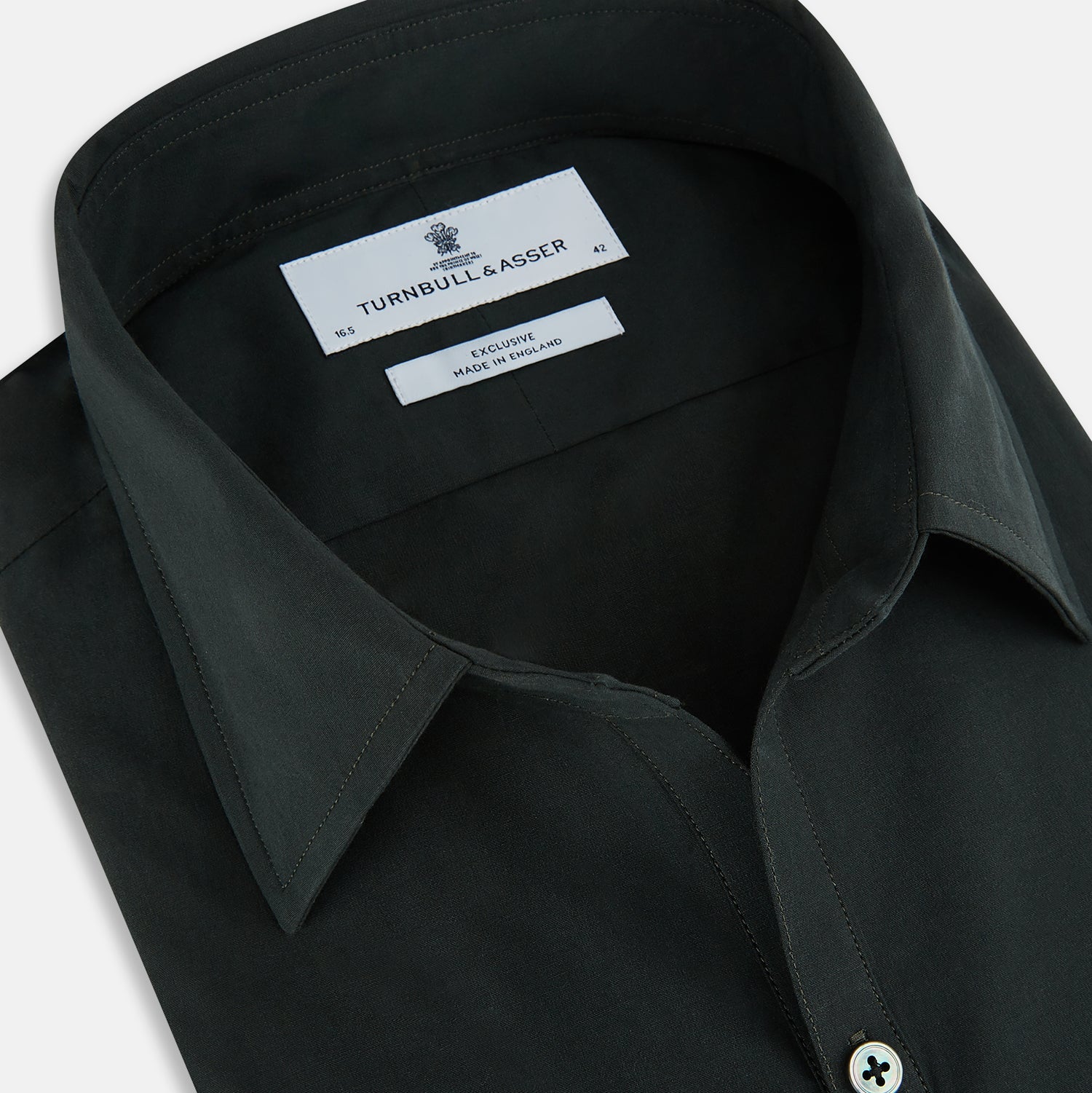 View 2 of product The FOREST GREEN WINDSOR SHIRT by Turnbull & Asser features long sleeves, a Windsor collar, and buttoned cuffs, reflecting British craftsmanship. Displayed on a plain white background.