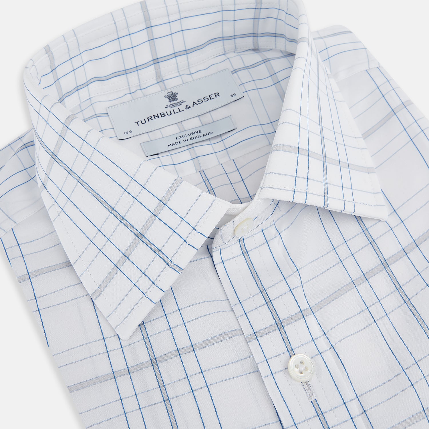 View 2 of product The Turnbull & Asser Blue and Grey Multi Check Mayfair Shirt features a T&A collar, cuffed long sleeves, and a light blue and gray plaid pattern on white.