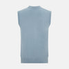 View 3 of product The Turnbull & Asser Frost Blue Cashmere Sleeveless Cardigan features a V-neck, five black buttons, two front pockets, and ribbed trim—ideal for layering in sophisticated outfits.