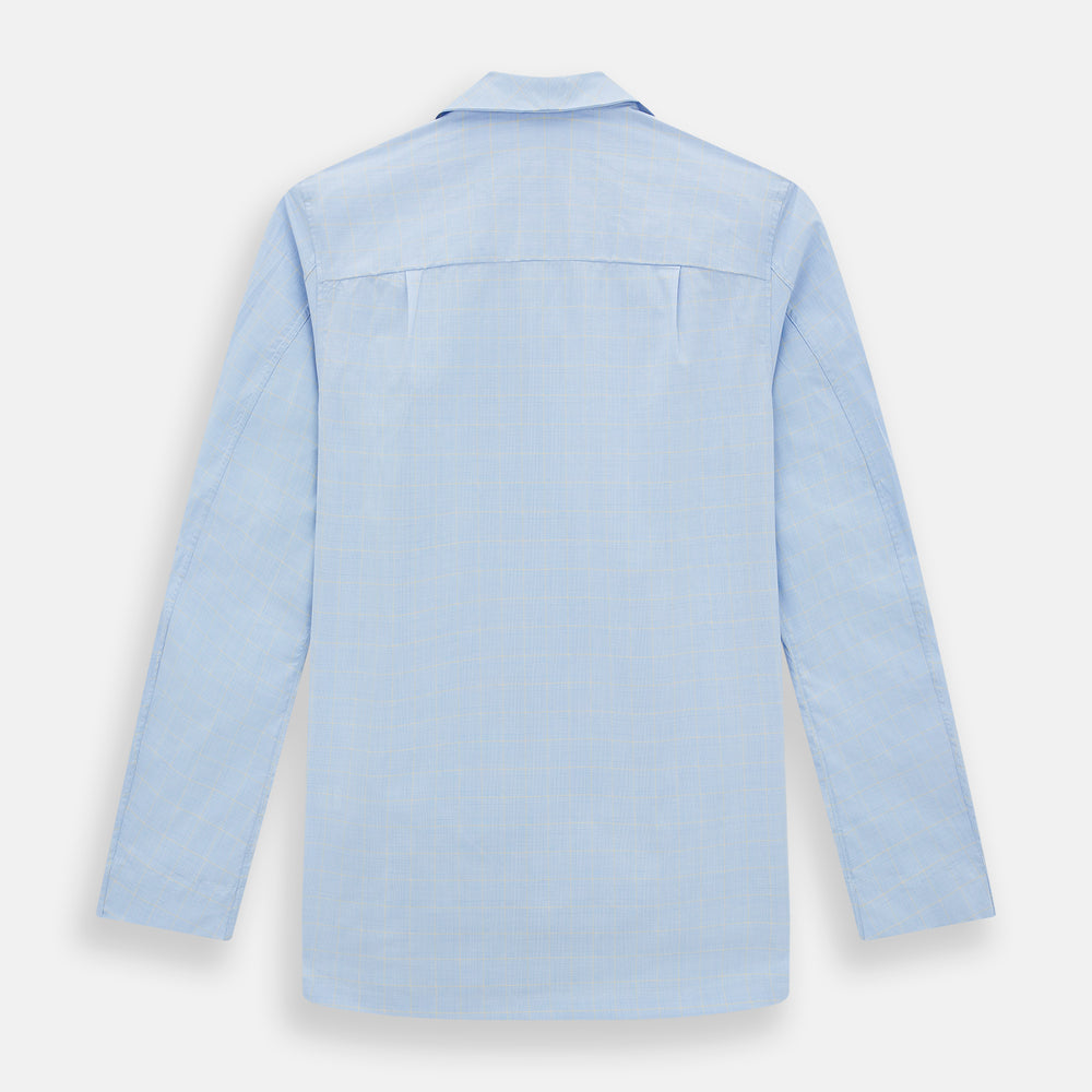 The Turnbull & Asser Blue Prince of Wales Check Pyjama Shirt features long sleeves, a notched collar, a left chest pocket, and a subtle check pattern, shown laid flat on a white background.
