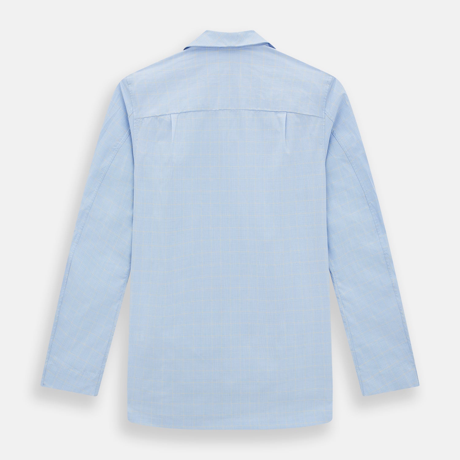 View 3 of product The Turnbull & Asser Blue Prince of Wales Check Pyjama Shirt features long sleeves, a notched collar, a left chest pocket, and a subtle check pattern, shown laid flat on a white background.