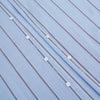 View 7 of product The Sky Blue Track Stripe Westminster Shirt by Turnbull & Asser features long sleeves, a Turnbull collar, and vertical dark blue and white stripes, displayed flat on a white surface.