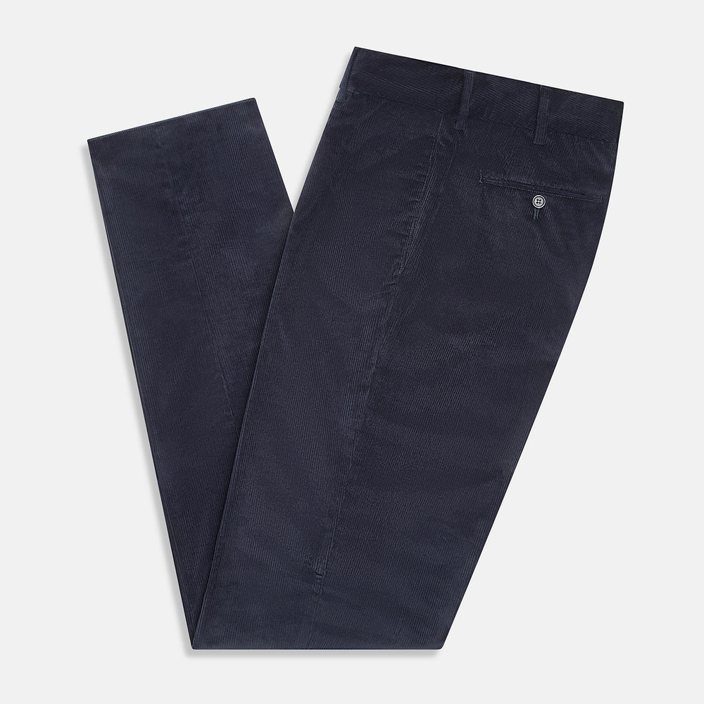Turnbull & Asser’s Navy Corduroy Edward Trousers feature a straight-leg cut, button closure, and side pockets, shown on a plain white background.